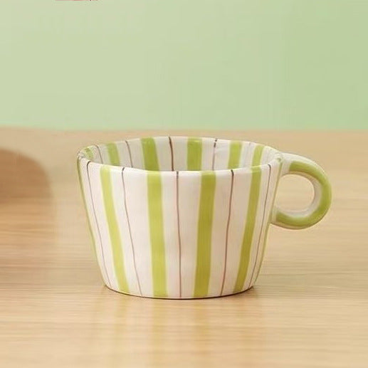 Ceramic coffee mug with ergonomic round handle and fine striped texture — product view 7