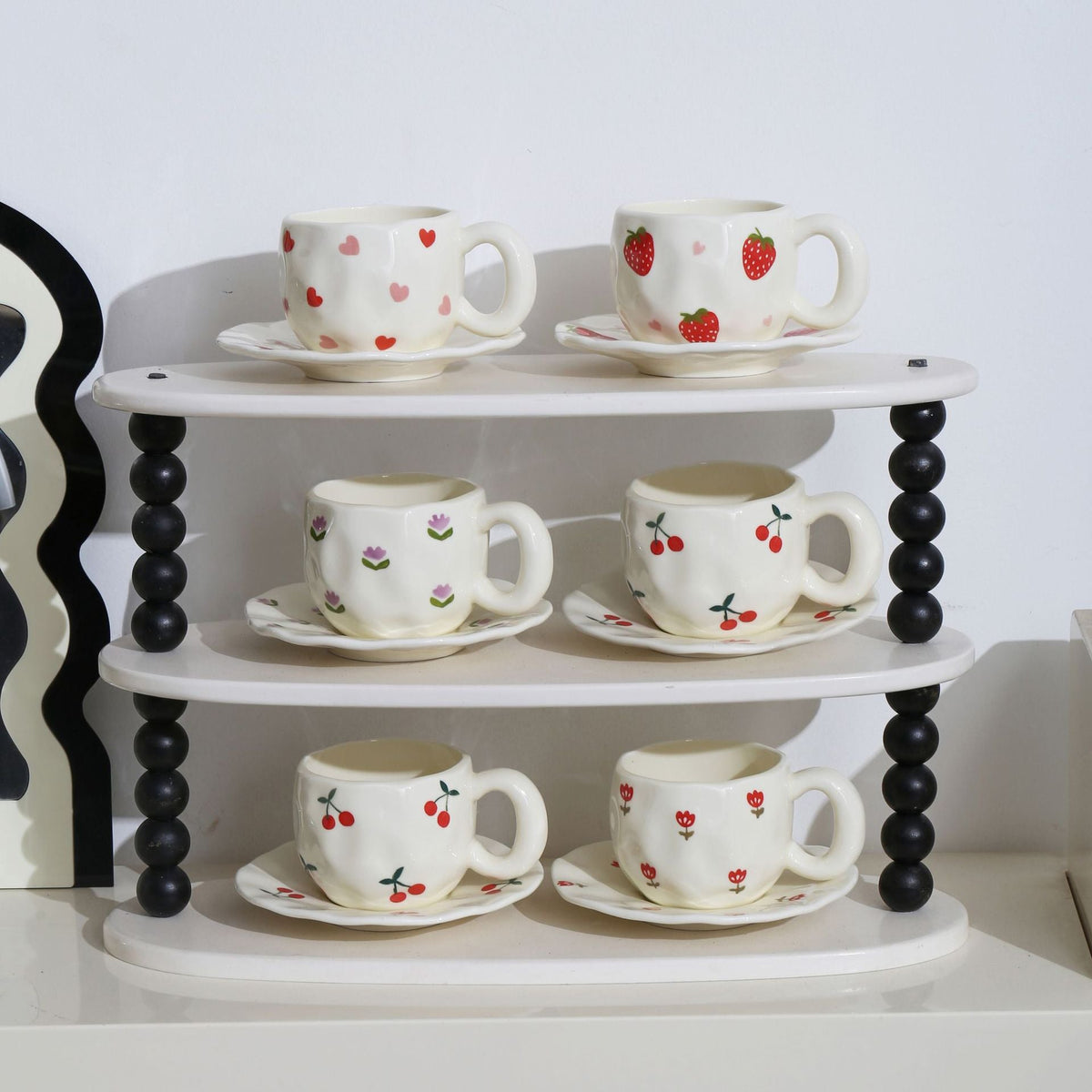 Ceramic mug with hand-painted tulip pattern and organic shape — product view 1