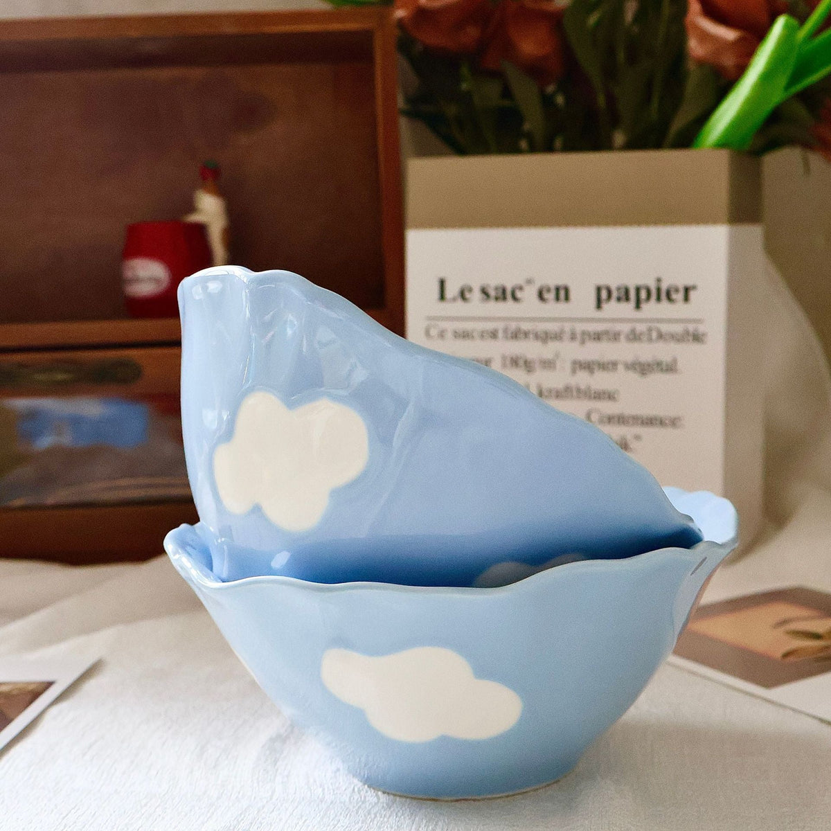 Decorative hand-painted ceramic bowl with wavy edge and tulip design — product view 1