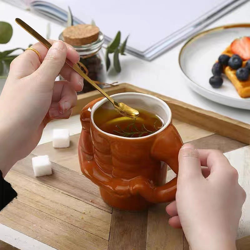 Ceramic mug in torso shape with muscular body and ergonomic handle — product view 2
