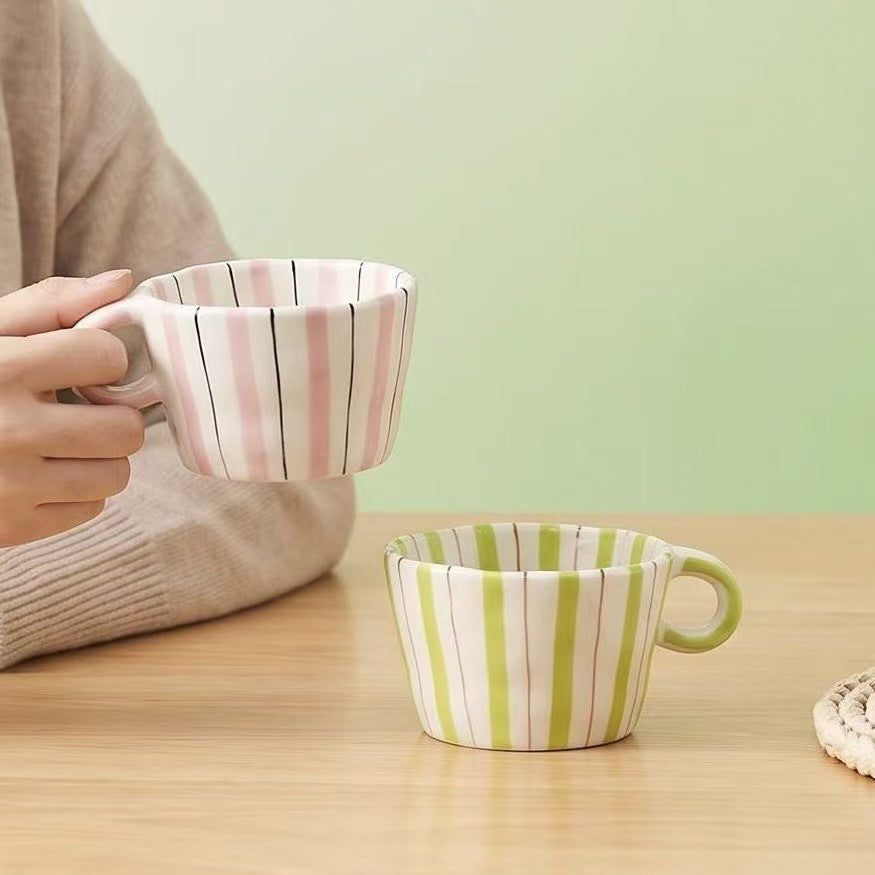 Ceramic coffee mug with ergonomic round handle and fine striped texture — product view 3