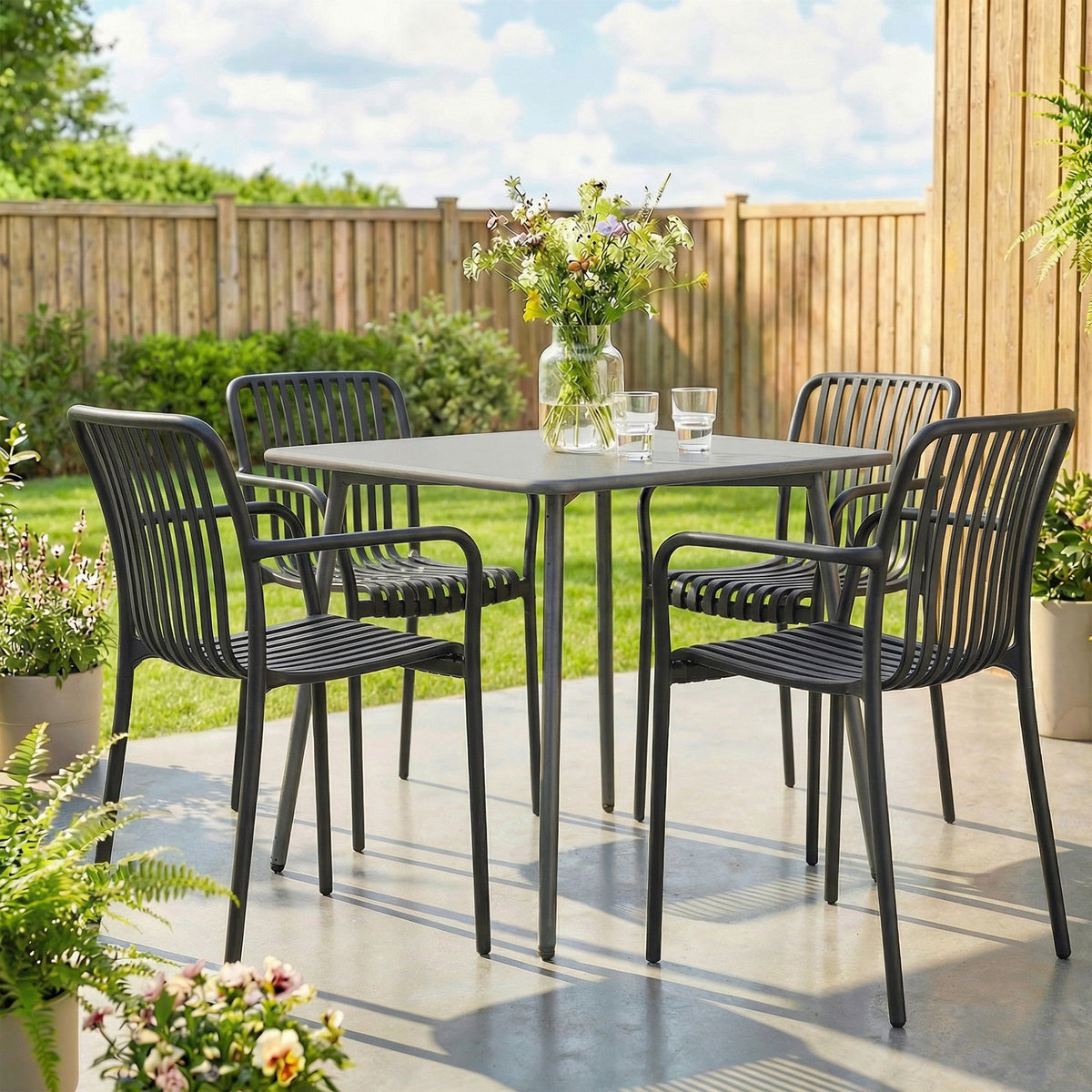 Stackable Patio Dining Chairs 4-Pack, Plastic Curved Back with Armrests, Black — product view 4