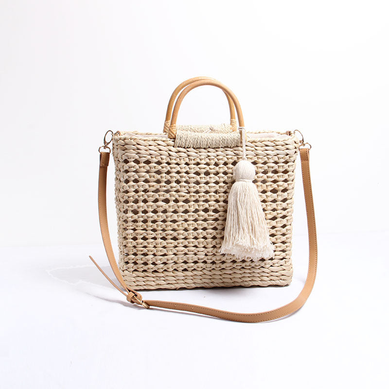 Handcrafted straw shoulder bag with decorative tassel pendant LoungeYard — product view 6