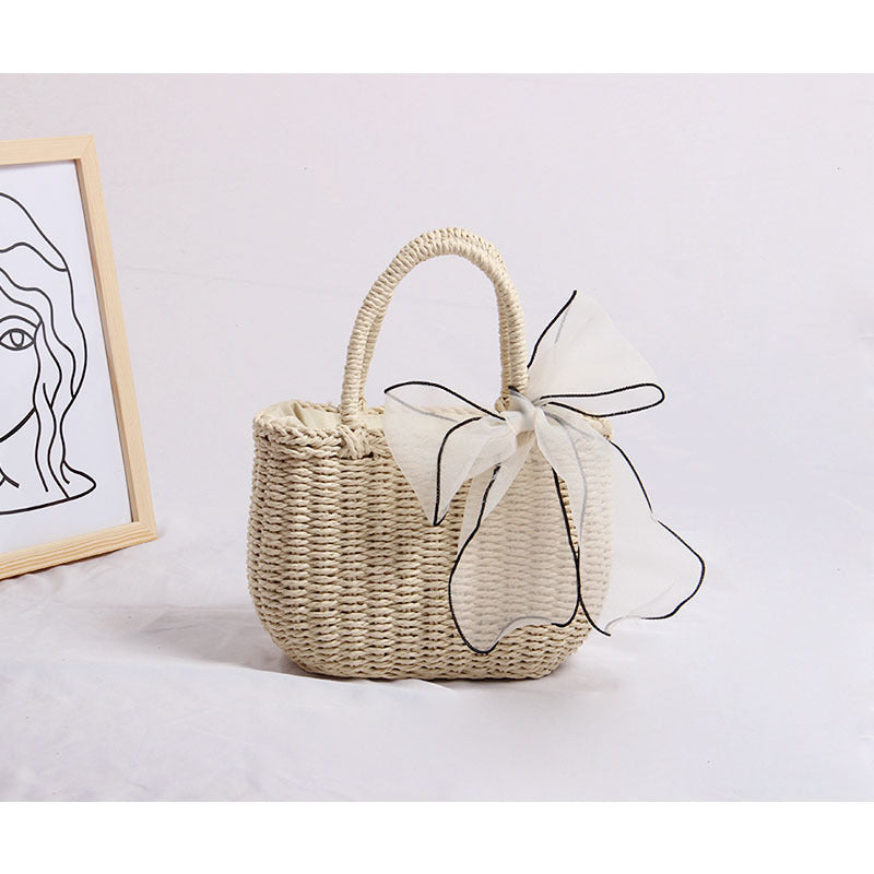 Handcrafted rattan bag with refined details LoungeYard — product view 1