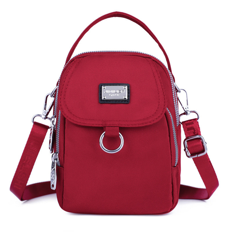 Water-Resistant Crossbody Phone Bag with Multiple Pockets and Adjustable Strap — product view 1