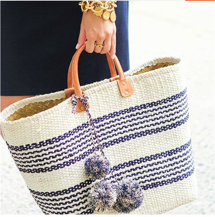 Stylish basket bag with playful pompons LoungeYard — product view 1