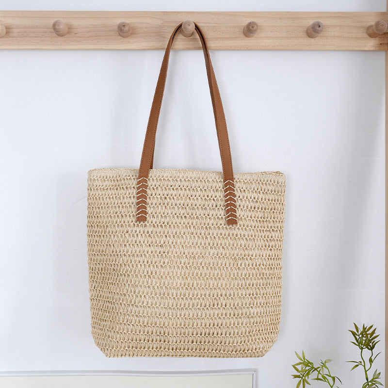 Spacious wicker tote bag with sturdy leather handles LoungeYard — product view 2