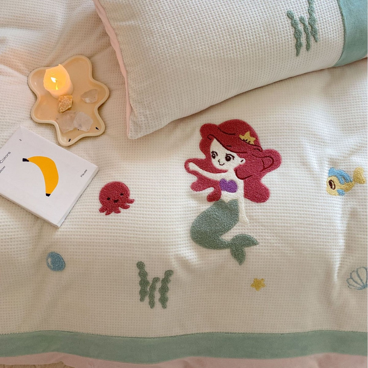 Cozy bedding set with plush border, embroidered appliqués, and reversible function — product view 4