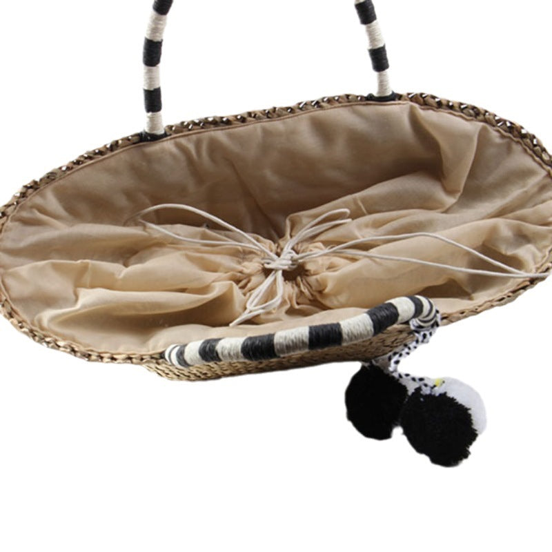 Braided beach bag with decorative pompons LoungeYard — product view 5