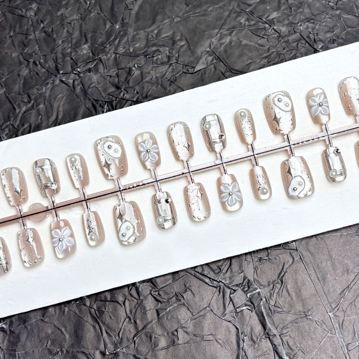 Artistic Press-On Nail Set with Floral and Metallic Accents — product view 2