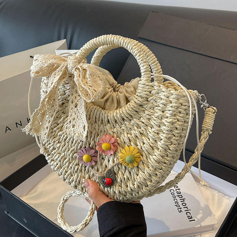 Handcrafted Floral Accent Straw Handbag — product view 1