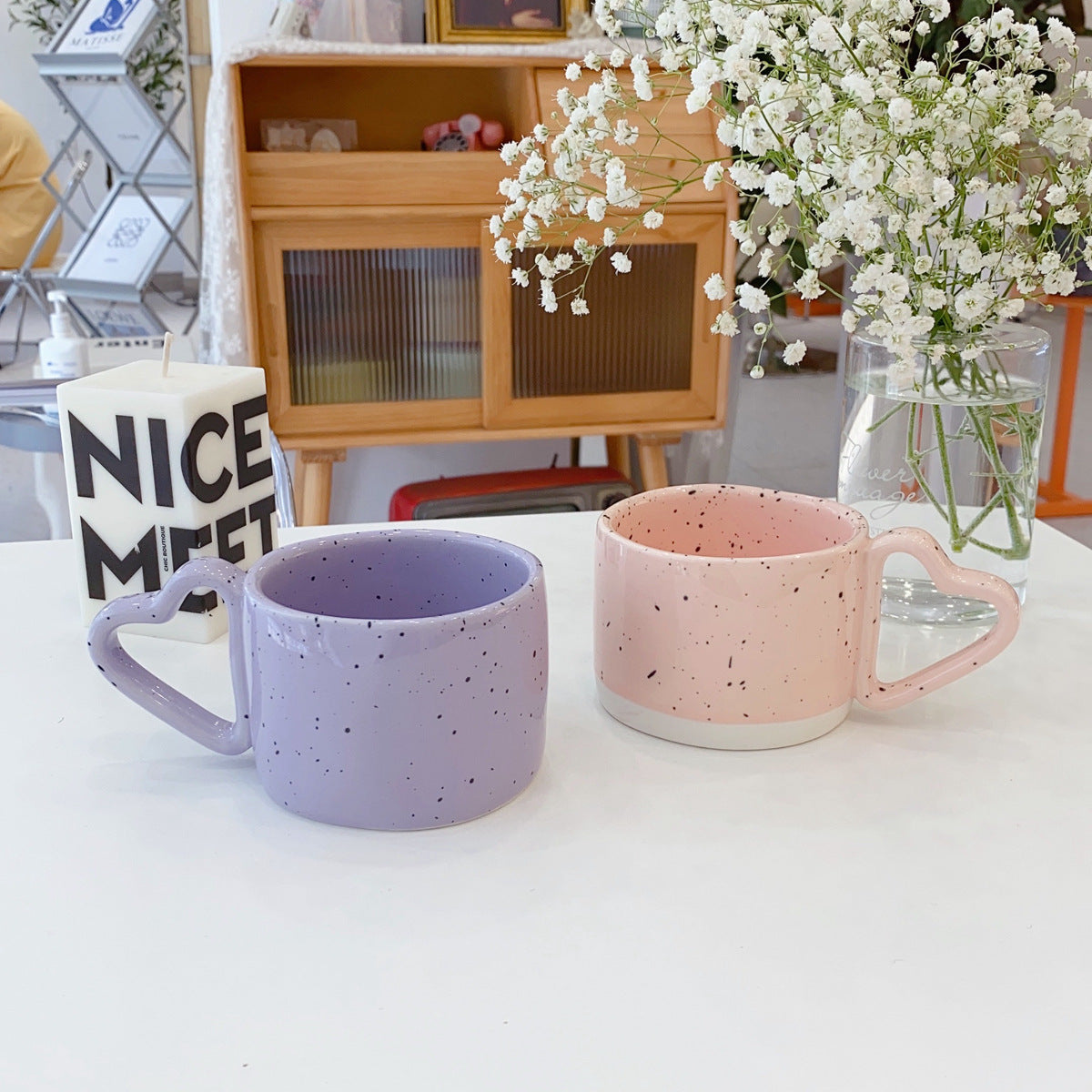 Oversized ceramic mug with heart-shaped handle and dotted glaze — product view 1