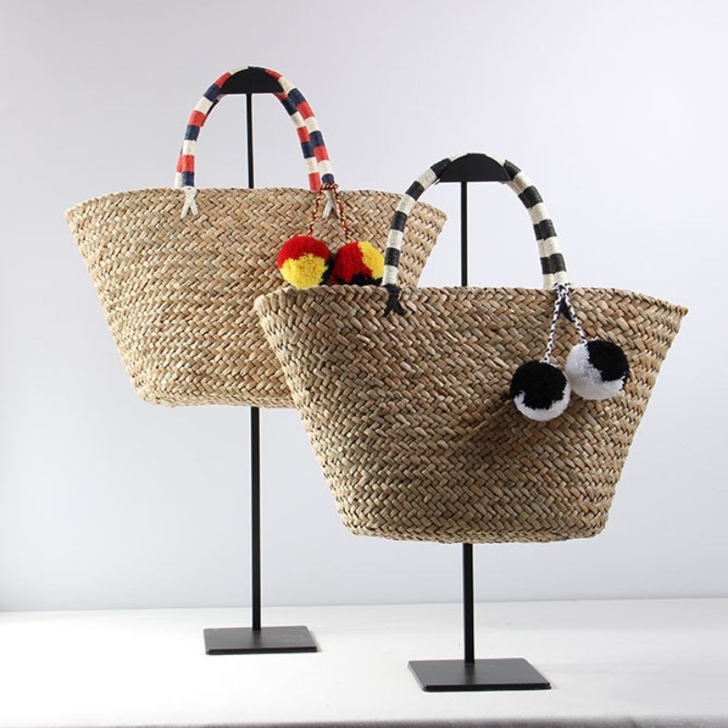 Braided beach bag with decorative pompons LoungeYard — product view 1