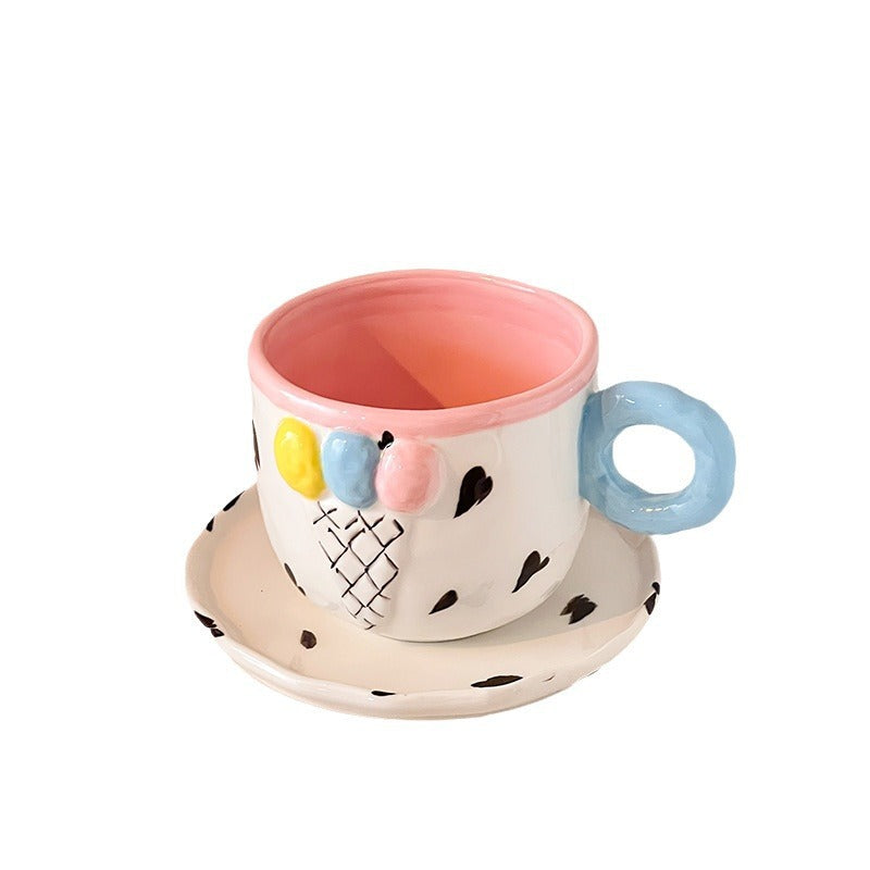 Playful handcrafted ceramic cup composition with saucer and pastel-colored round handle — product view 5