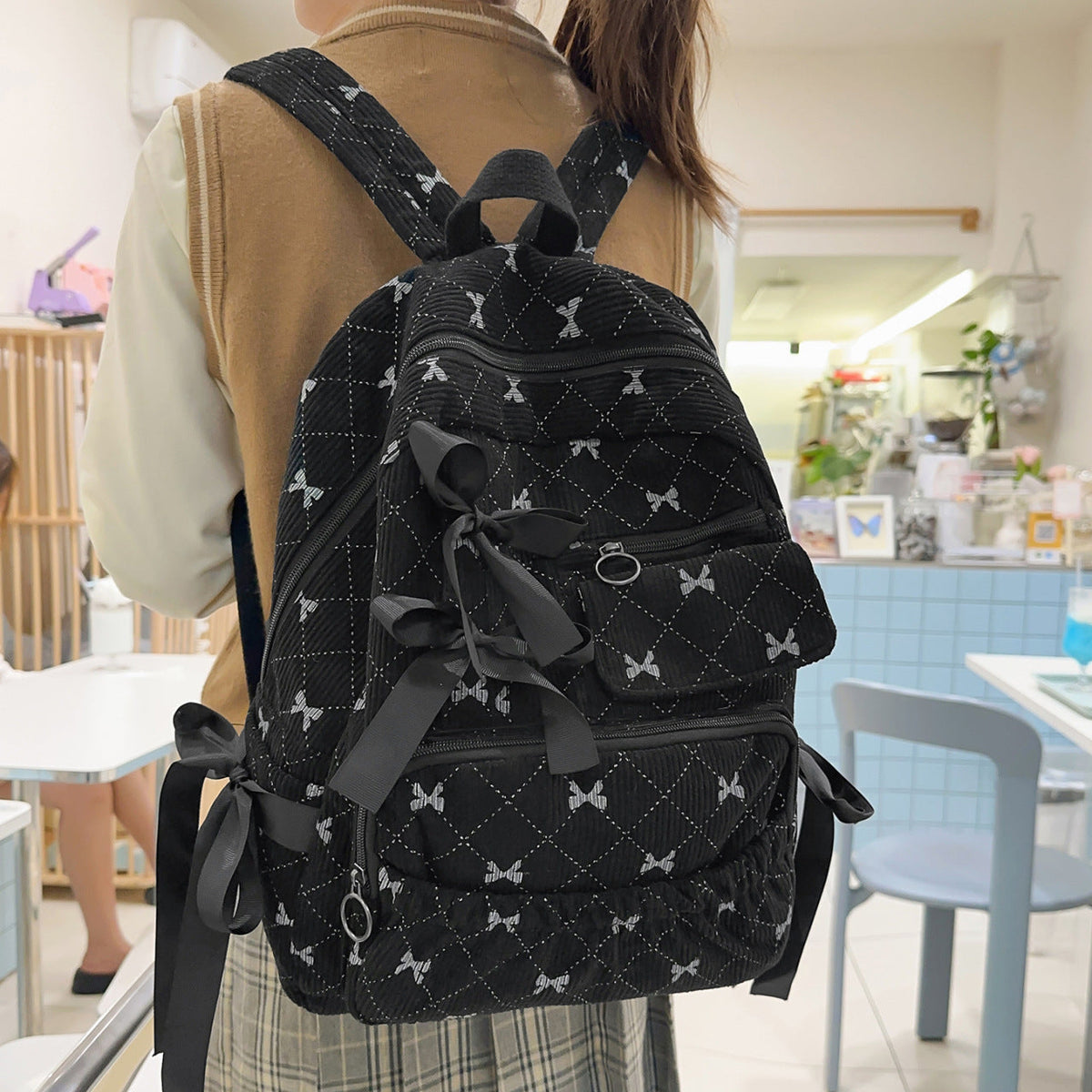 Playful backpack with bow details and practical compartments LoungeYard — product view 5