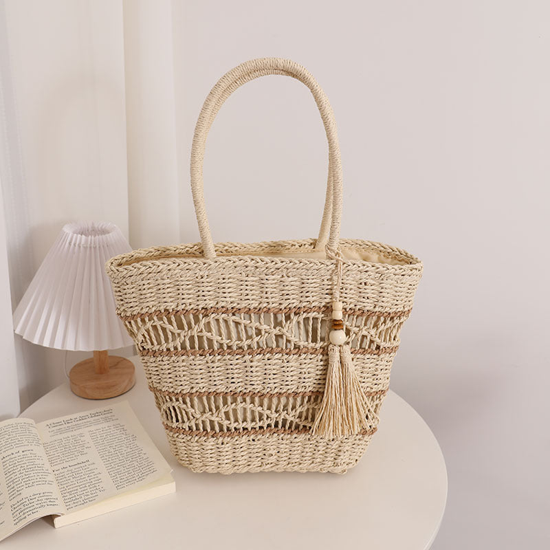 Handcrafted straw tote bag with decorative tassel detail LoungeYard — product view 7