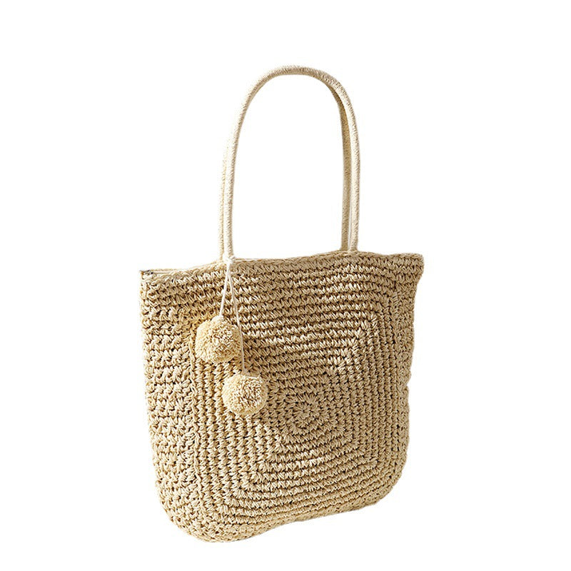 Handmade straw bag with pompom details LoungeYard — product view 5