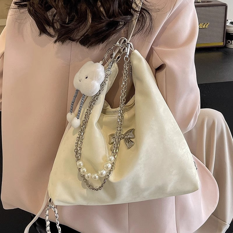 Fashionable handbag with unique pendant and chain accents LoungeYard — product view 2