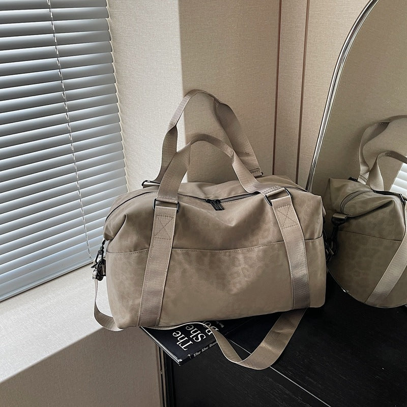 Sporty duffel bag with animal pattern and practical carrying options LoungeYard — product view 1