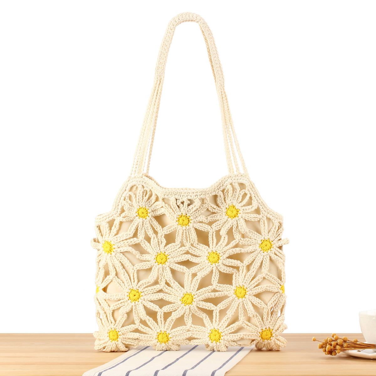 Handcrafted macrame bag with floral accents LoungeYard — product view 1