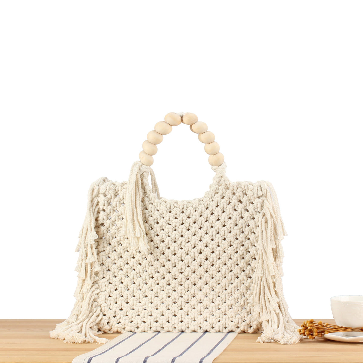 Creative crochet handbag with decorative fringes LoungeYard — product view 1
