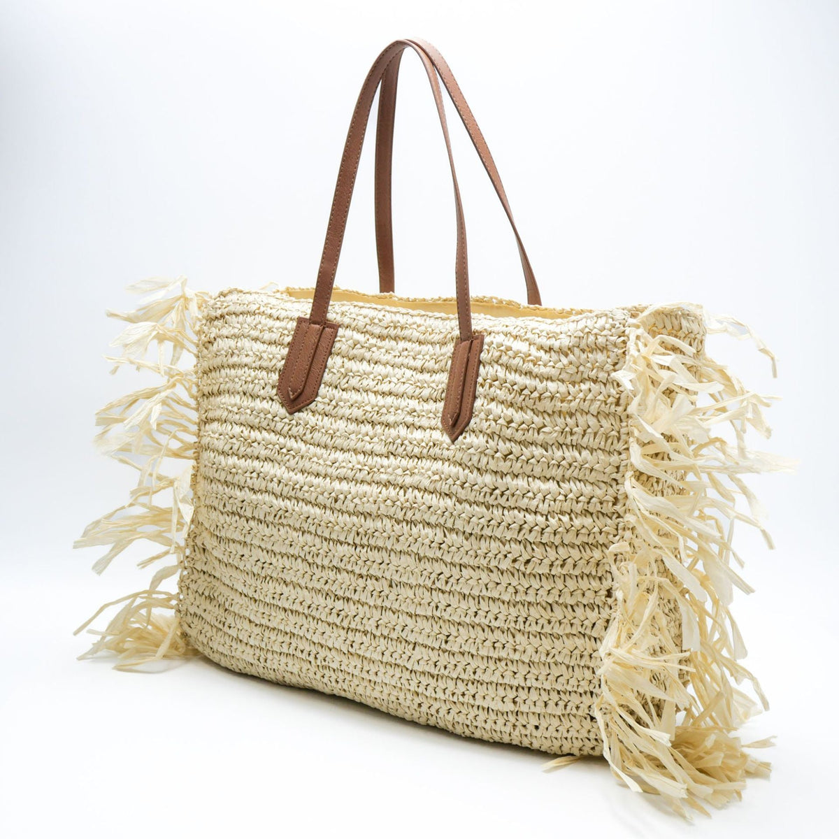 Beach bag made of handwoven straw with fringes LoungeYard — product view 1