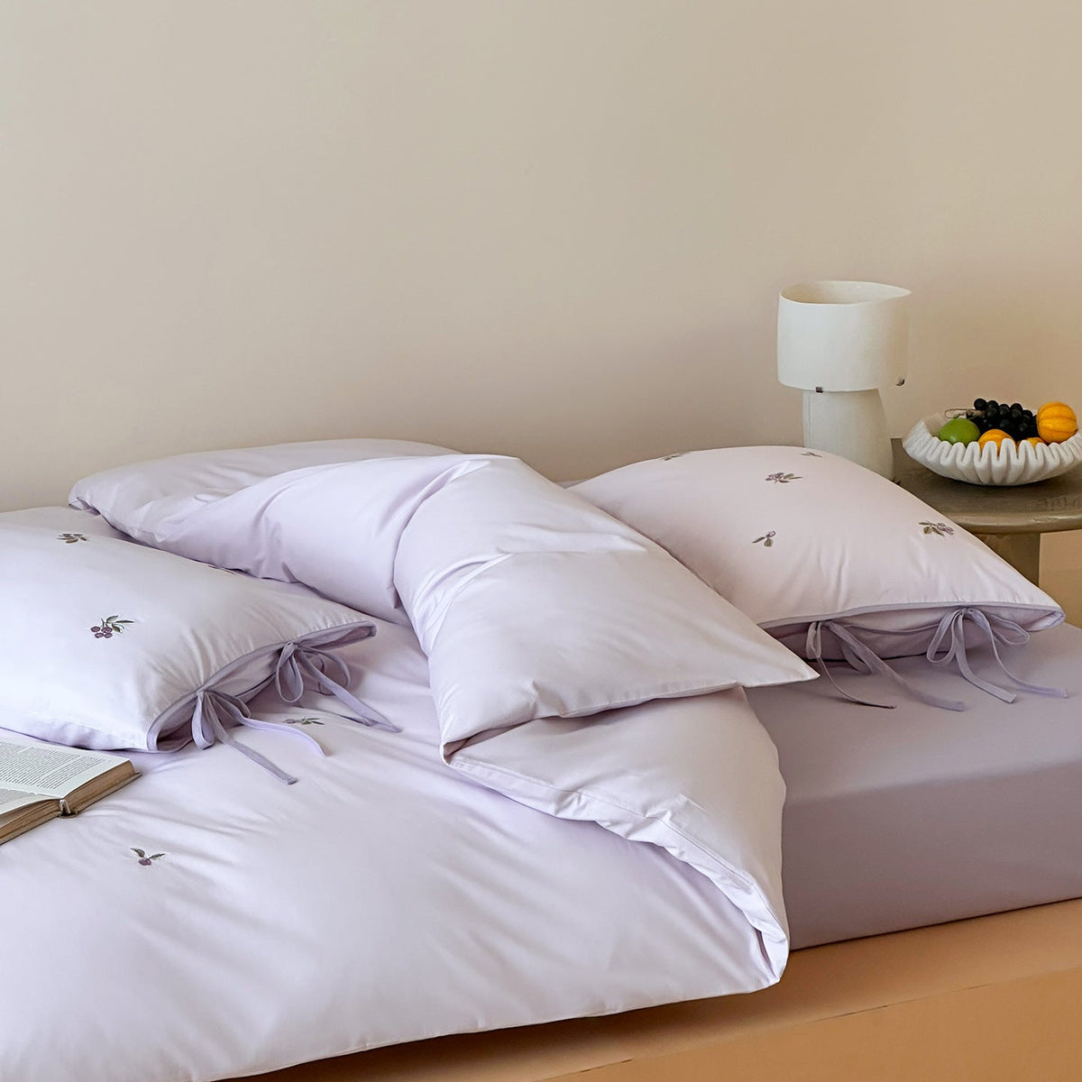 Reversible cotton bedding set with fine check pattern, cherry embroidery, and decorative tie ribbons — product view 2