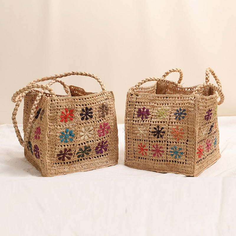 Handcrafted straw bag with colorful embroidery design LoungeYard — product view 1