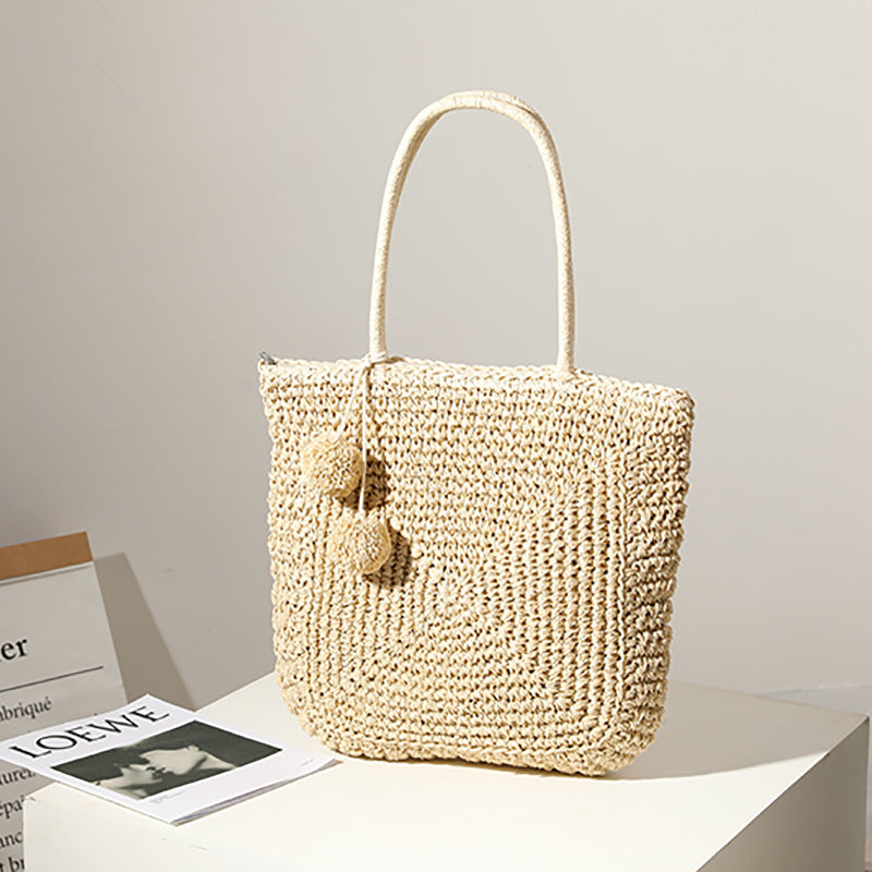 Handmade straw bag with pompom details LoungeYard — product view 4