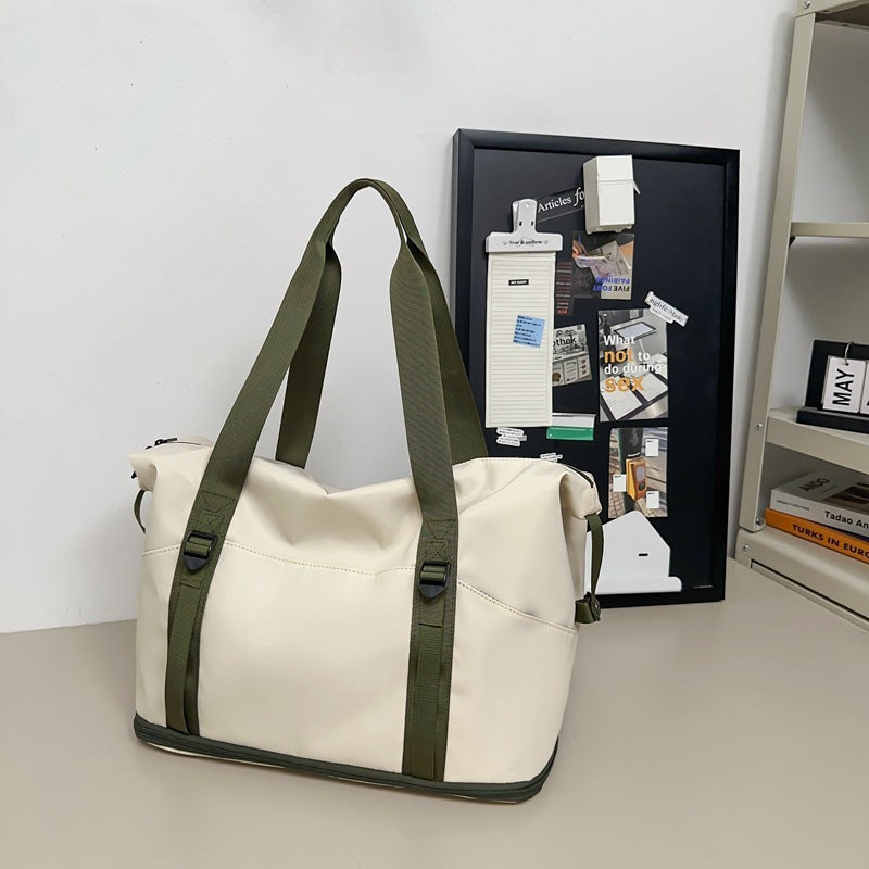 Sporty shoulder bag with water-repellent material and sturdy carrying handles LoungeYard — product view 6