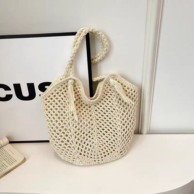 Handcrafted straw bag with tassels LoungeYard — product view 6