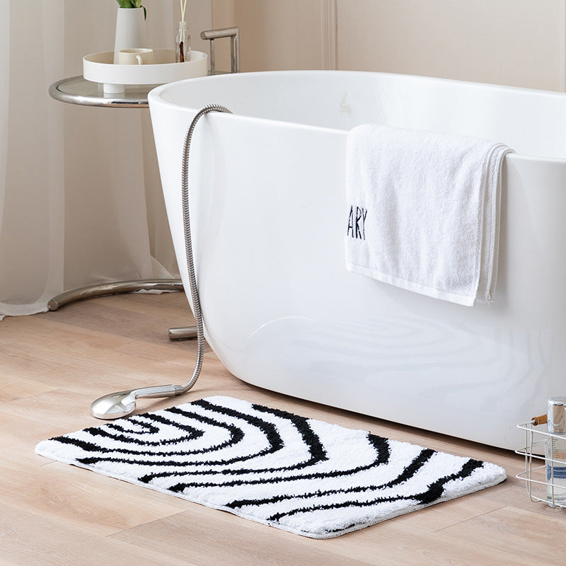 Fluffy bath mat in a graphic wave relief with anti-slip base LoungeYard — product view 1