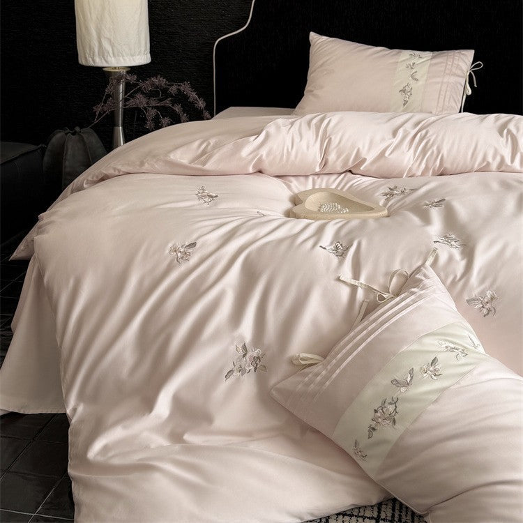 Luxurious satin bedding set with embroidered floral appliqués and bolster LoungeYard — product view 3