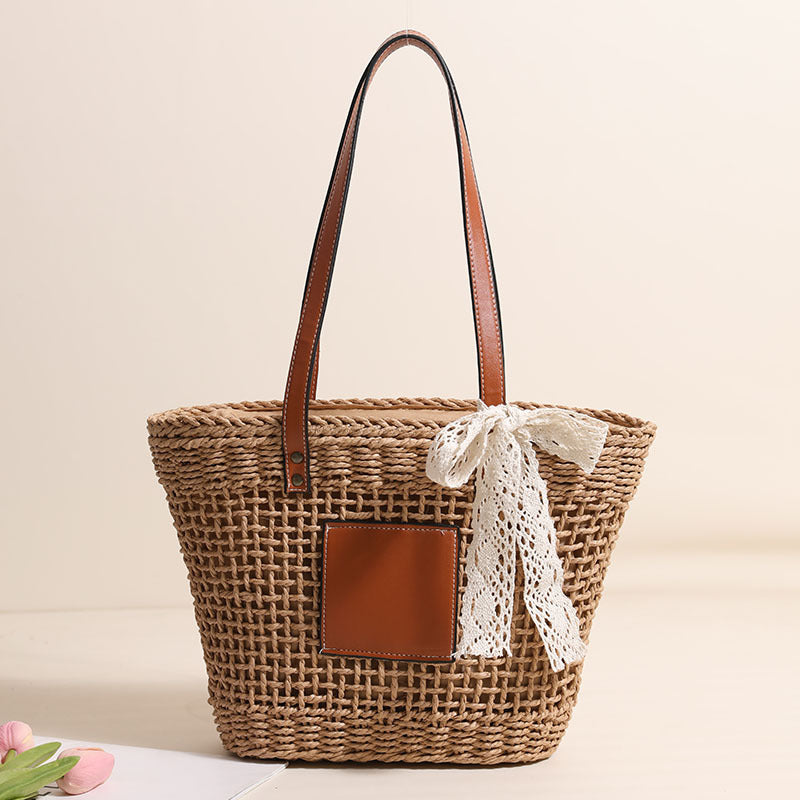 Handmade straw bag with elegant leather accents LoungeYard — product view 1