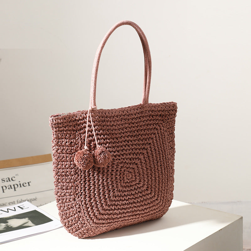 Handmade straw bag with pompom details LoungeYard — product view 2