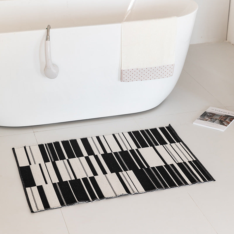 Flat-woven bath mat with abstract geometric pattern LoungeYard — product view 2