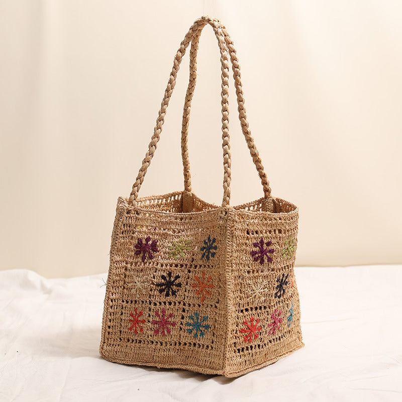 Handcrafted straw bag with colorful embroidery design LoungeYard — product view 3