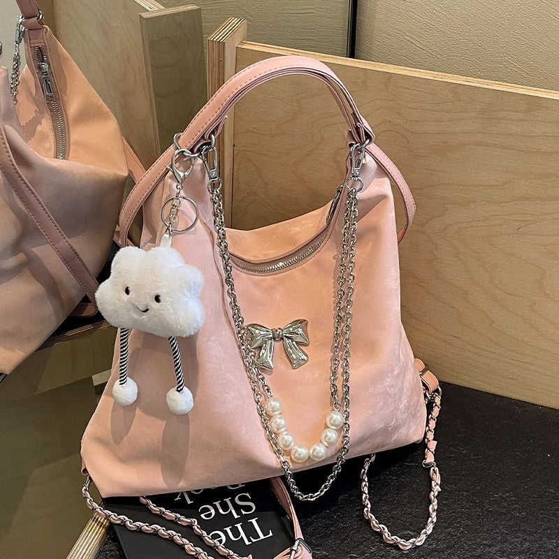 Fashionable handbag with unique pendant and chain accents LoungeYard — product view 4