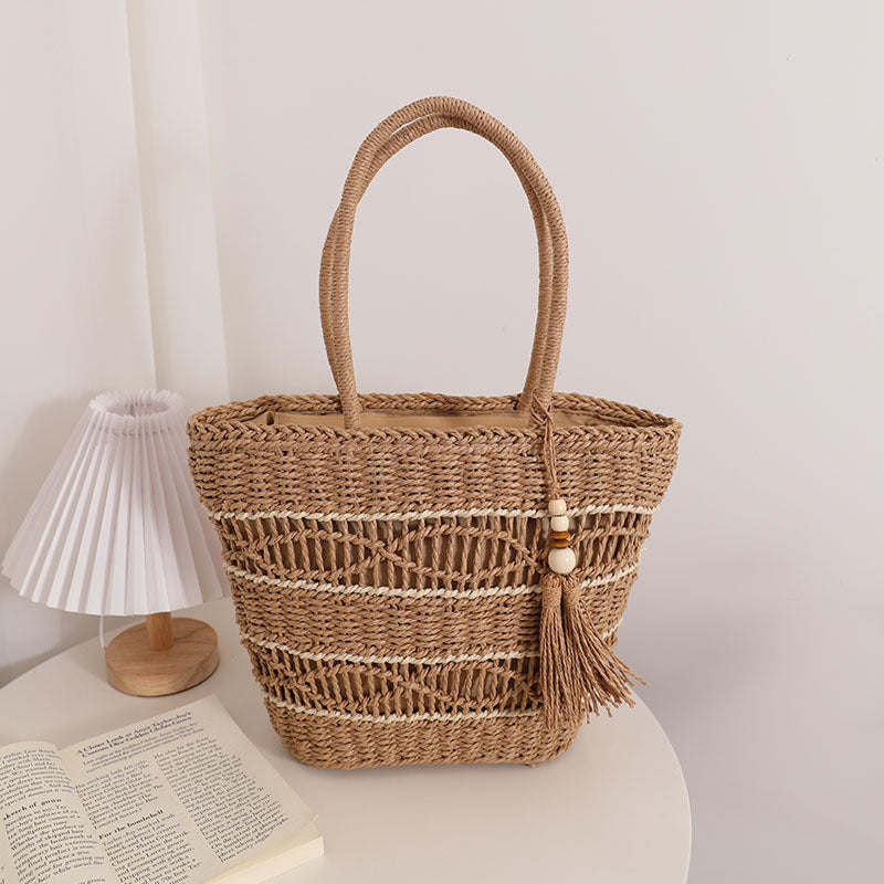 Handcrafted straw tote bag with decorative tassel detail LoungeYard — product view 6