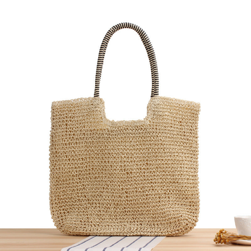Handmade straw shoulder bag with structured design LoungeYard — product view 1