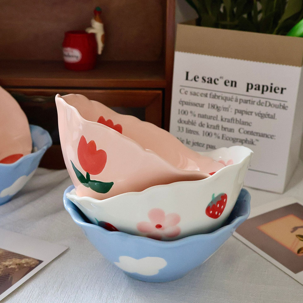 Decorative hand-painted ceramic bowl with wavy edge and tulip design — product view 3