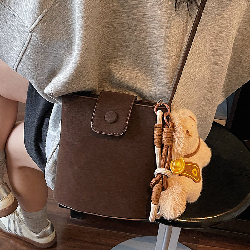 Compact Crossbody Bag with Cute Plush Charm — product view 1