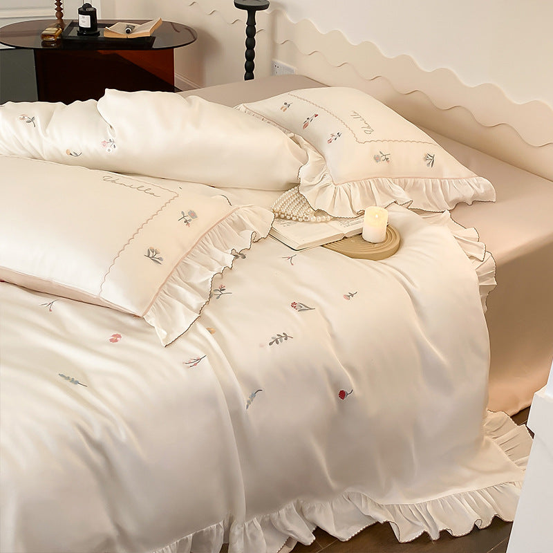 Romantic cotton satin bedding set with delicate floral embroidery and ruffle trim — product view 7