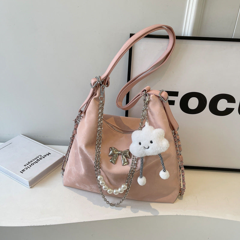Fashionable handbag with unique pendant and chain accents LoungeYard — product view 6