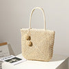 Handmade straw bag with pompom details LoungeYard — product view 6