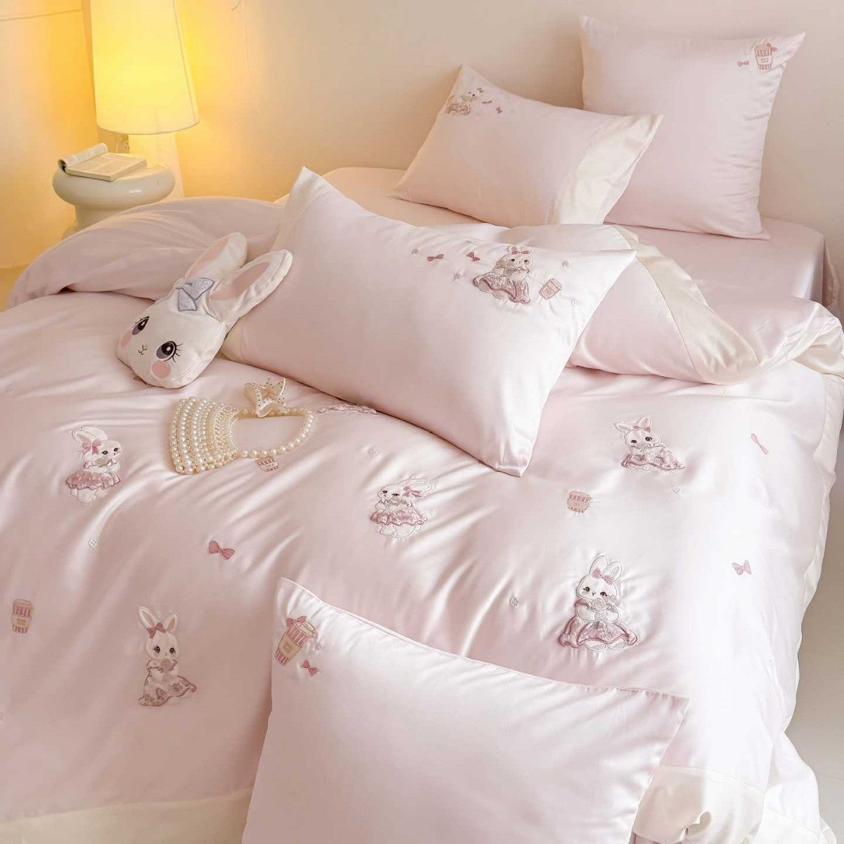 Children's bedding set with embroidered bunny appliqués and satin trim — product view 1