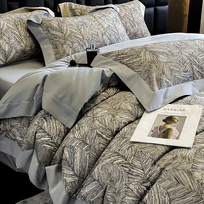 Elegant bed linen set made of cotton satin with a subtle leaf pattern and contrast piping — product view 2