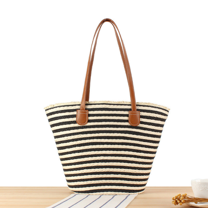 Braided beach bag with modern stripes and sturdy handles LoungeYard — product view 1