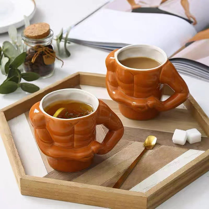 Ceramic mug in torso shape with muscular body and ergonomic handle — product view 1