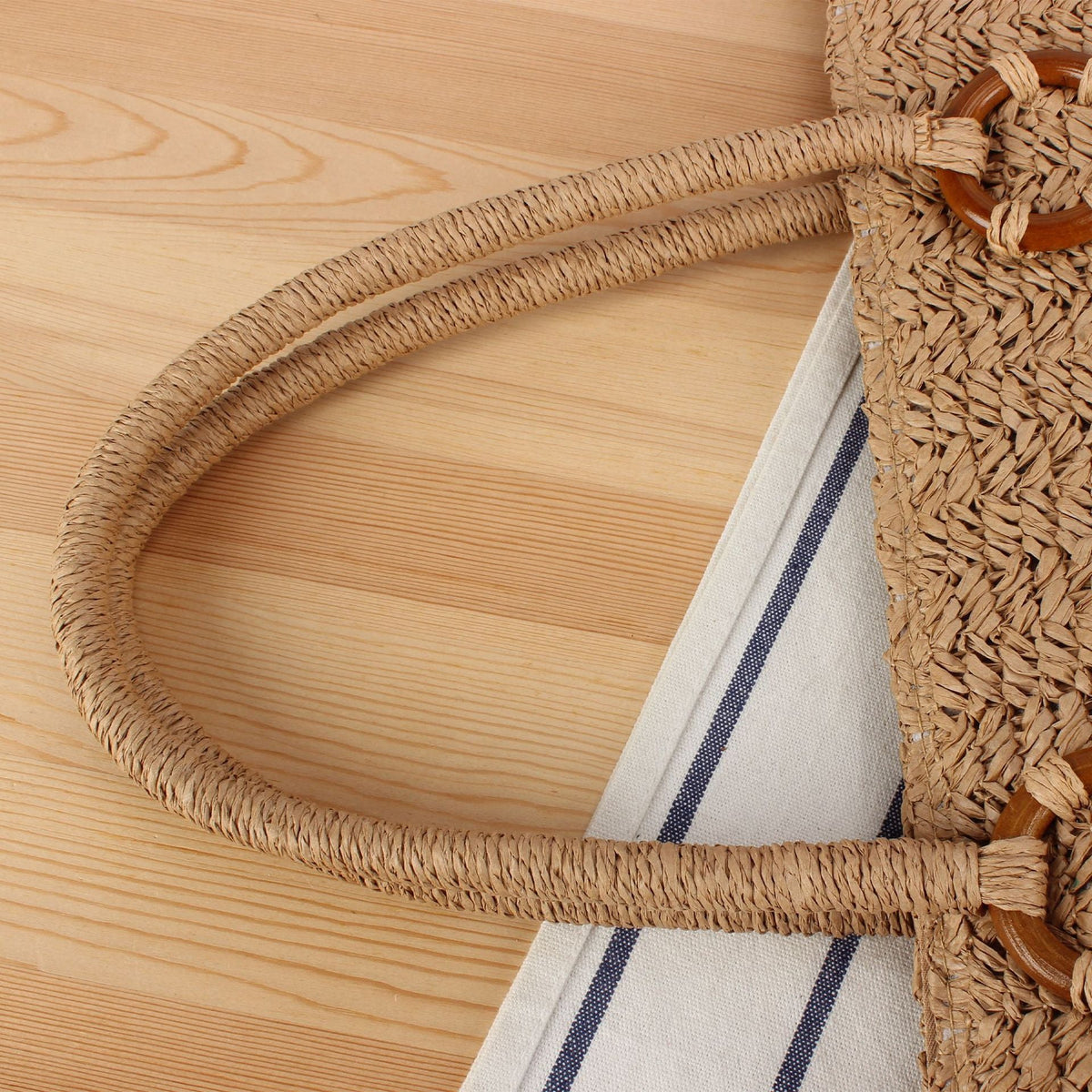 Beach bag made of natural woven material with sturdy carry handles LoungeYard — product view 2
